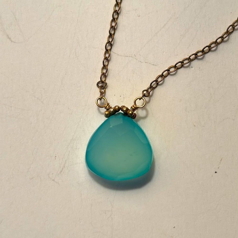 Dainty mint green faceted stone pendant on silver tone chain